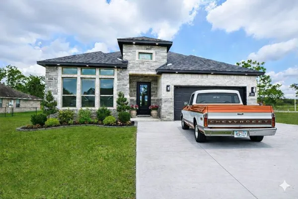 front view of a house with a yard