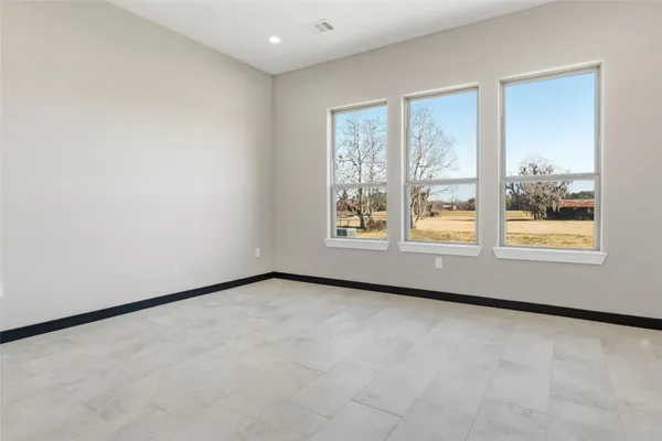 an empty room with windows