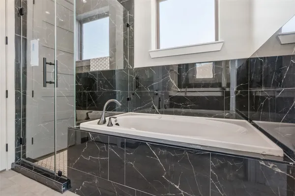 a bathroom with a sink and a bathtub