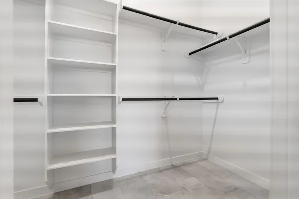 a bathroom with a glass door shower