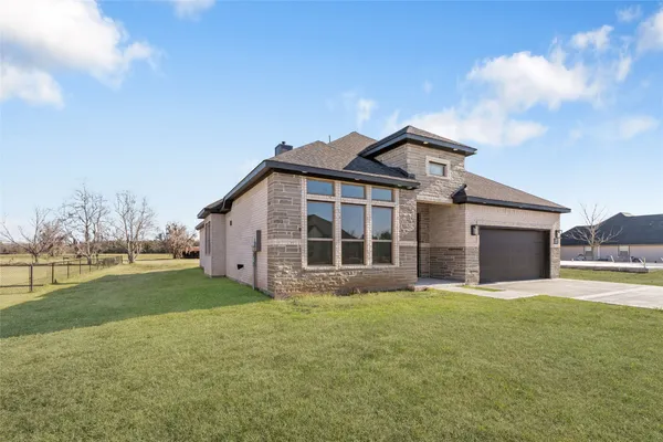 a big house with a big yard and more windows