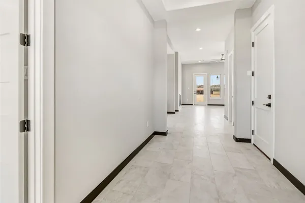 a view of a hallway with a room