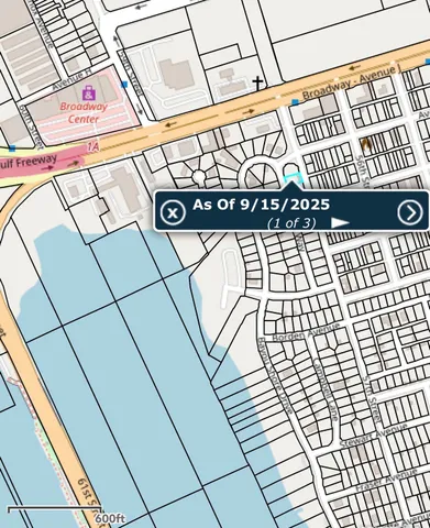 a view of a street sign on a brick wall