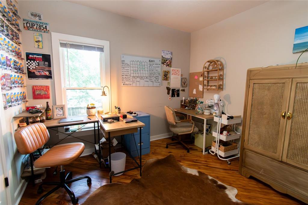 702 Radford Street Monroe, GA 30655 - Photo 19 of 49 a view of a workspace with furniture and a window