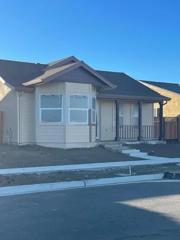 a front view of a house with a garage