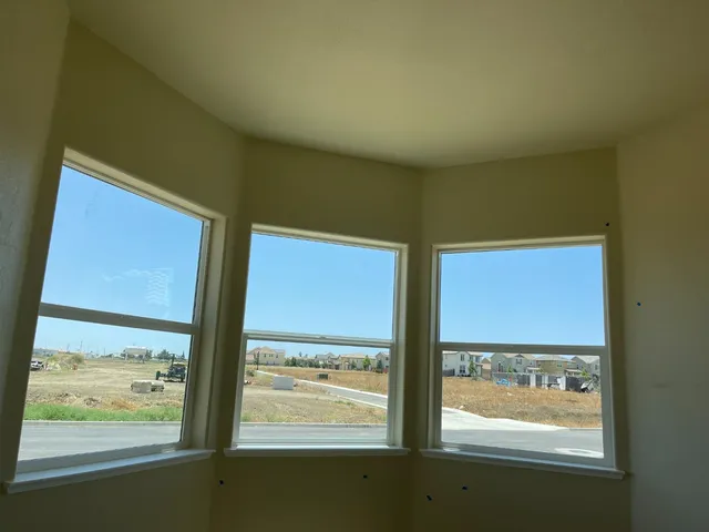 a view of a room with a large window