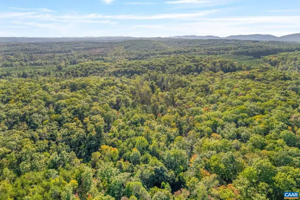 a view of a field of mountains and valleys