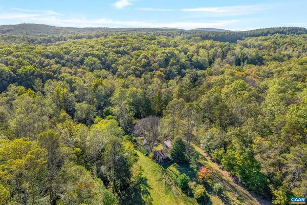 a view of a city with mountains in the background