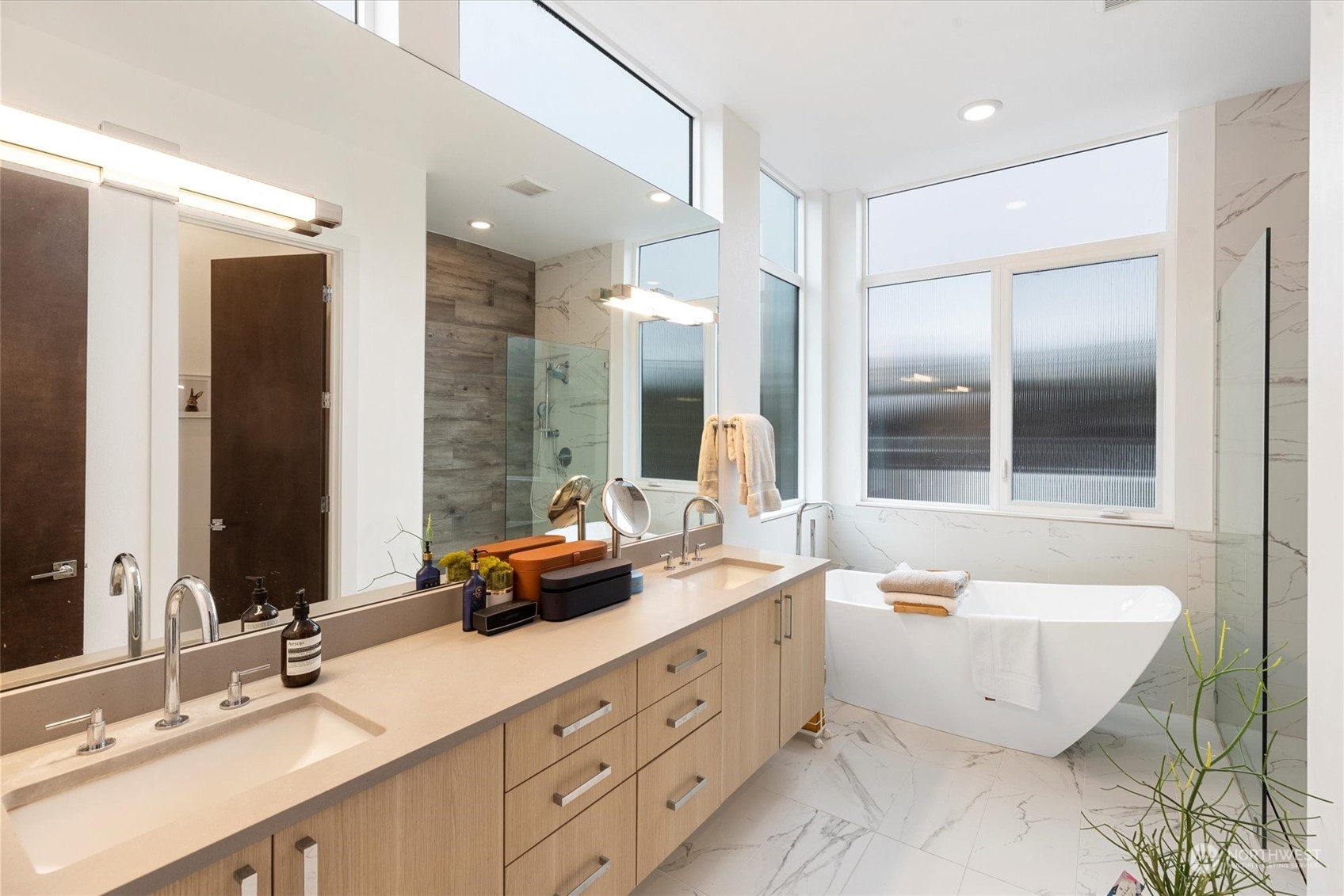 375 3rd Place Northwest Issaquah, WA 98027 - Photo 11 of 24 a bathroom with a tub sink double vanity and mirror