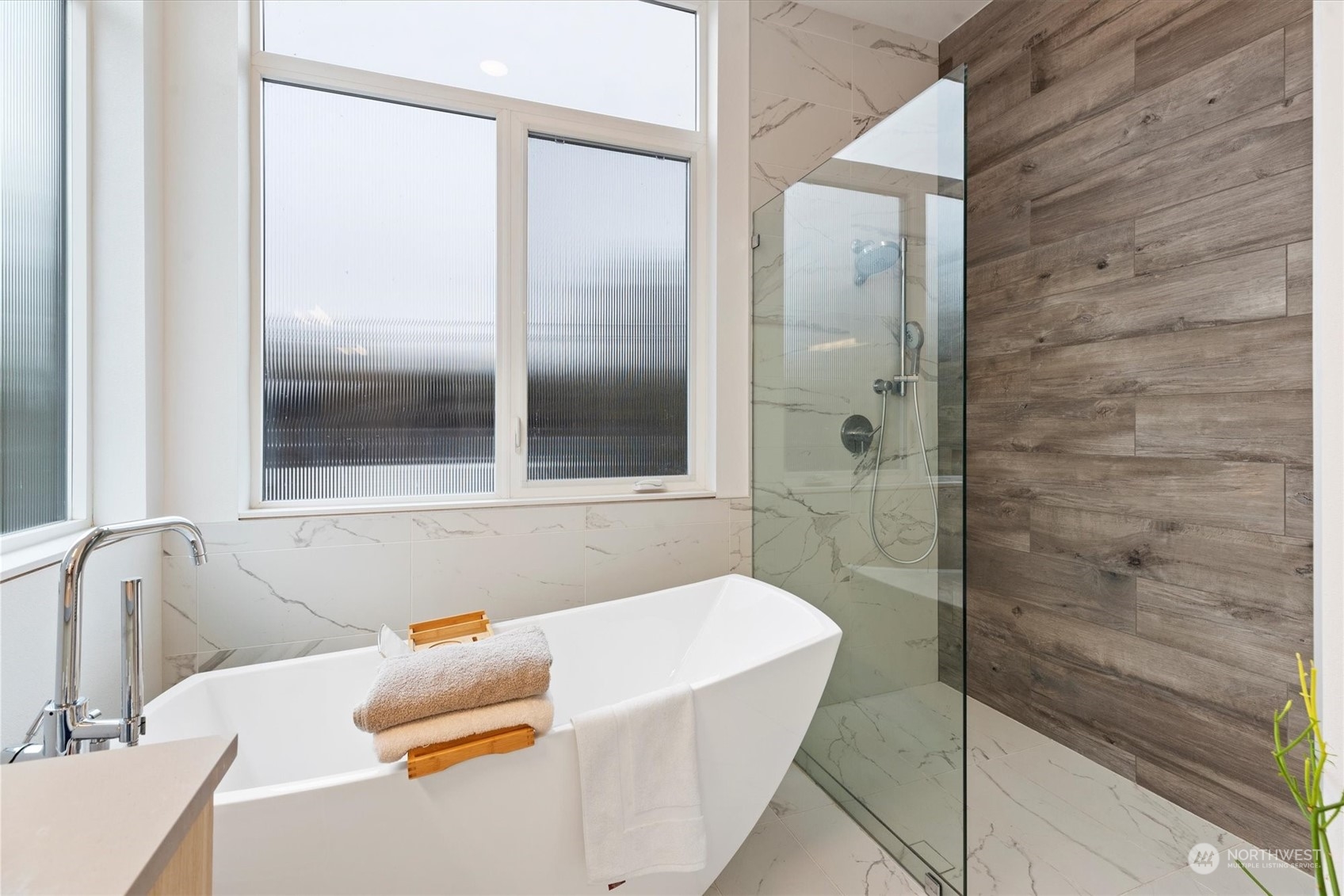 375 3rd Place Northwest Issaquah, WA 98027 - Photo 12 of 24 a bathroom with a tub and shower