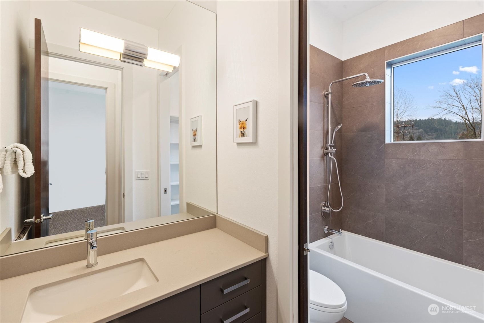 375 3rd Place Northwest Issaquah, WA 98027 - Photo 14 of 24 a bathroom with a sink a toilet a tub and shower