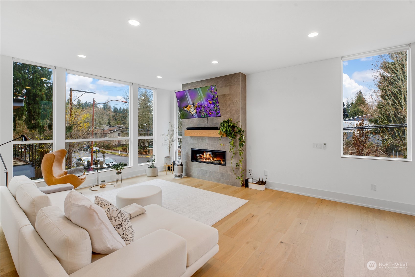 375 3rd Place Northwest Issaquah, WA 98027 - Photo 2 of 24 a living room with fireplace furniture and a floor to ceiling window