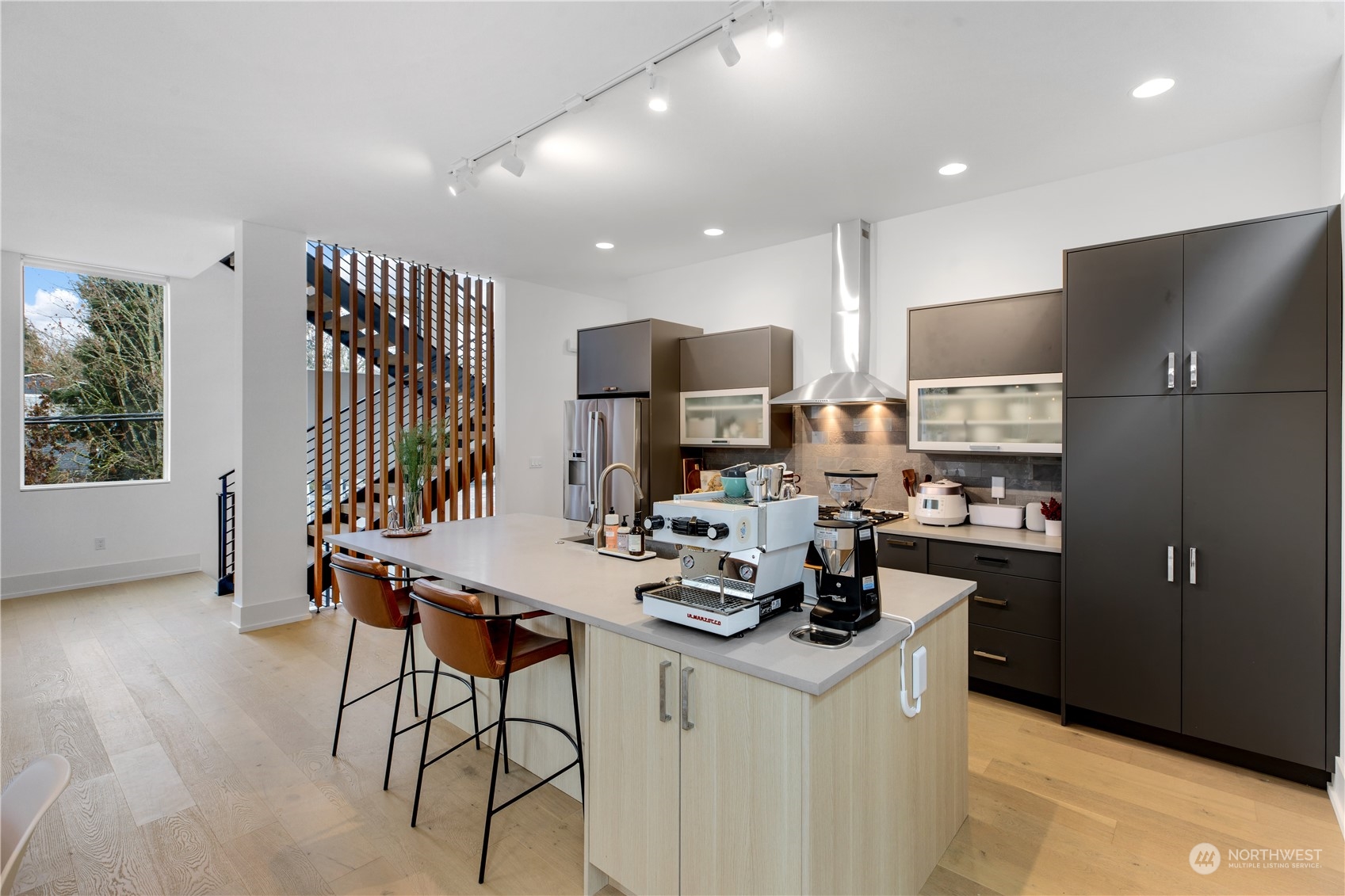 375 3rd Place Northwest Issaquah, WA 98027 - Photo 3 of 24 a kitchen with a refrigerator and a stove top oven