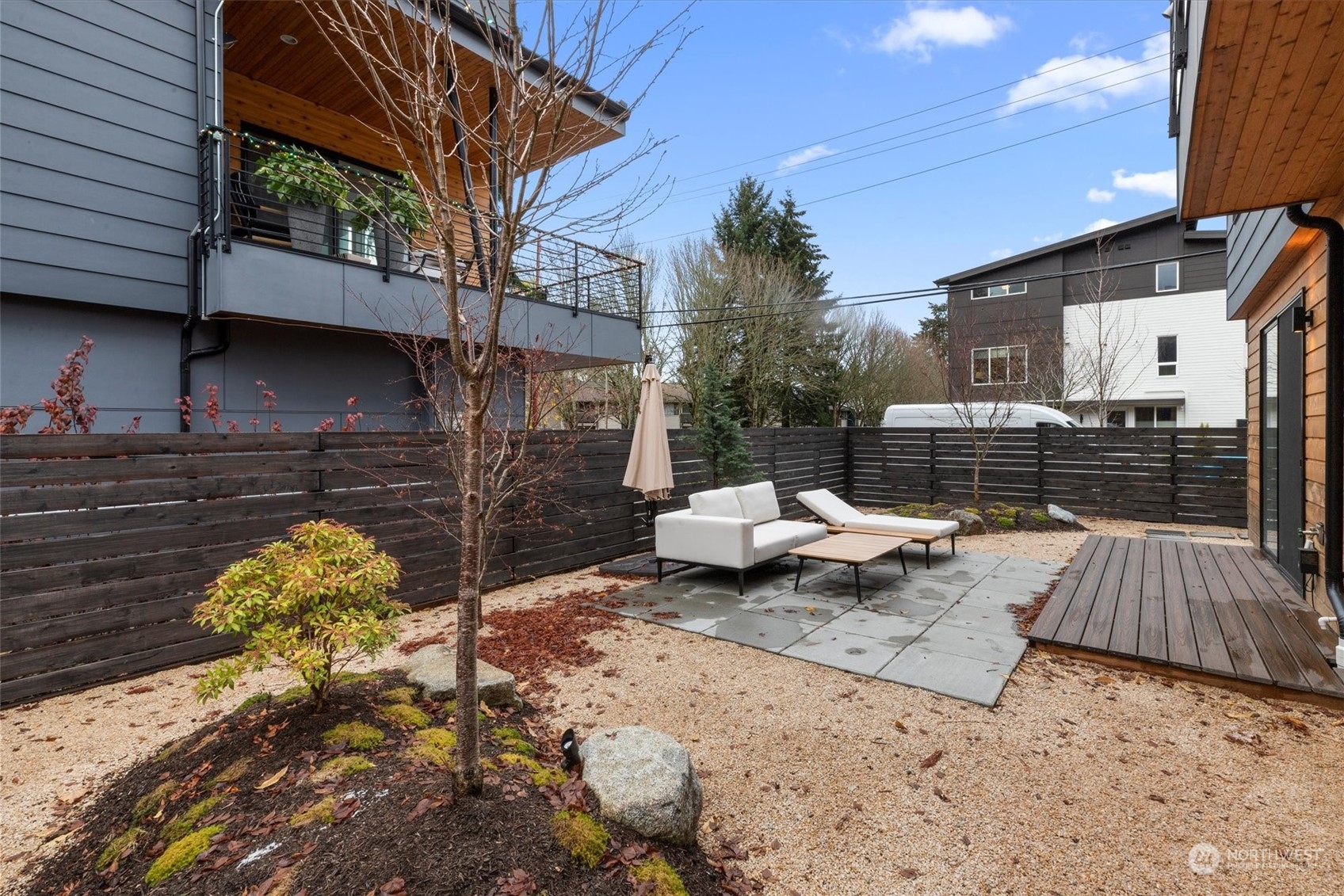 375 3rd Place Northwest Issaquah, WA 98027 - Photo 5 of 24 a view of backyard with a table and chair and potted plants