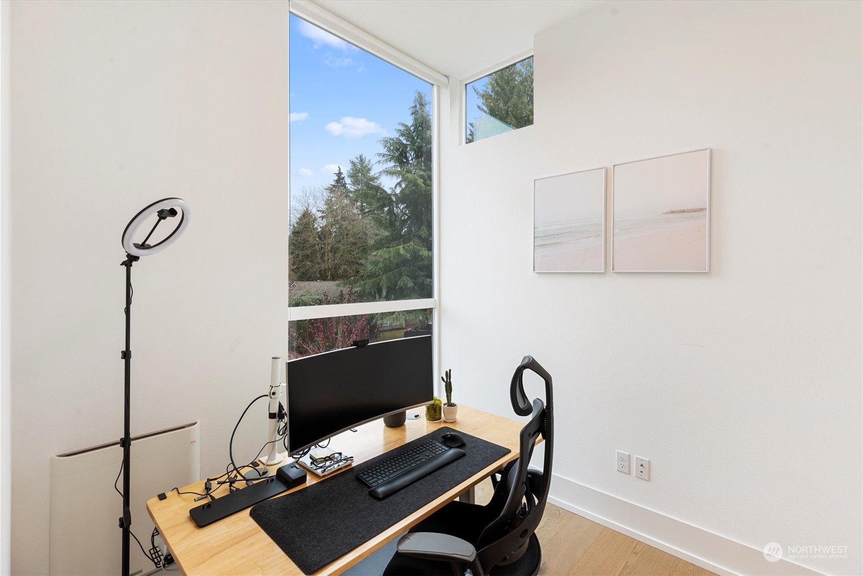 375 3rd Place Northwest Issaquah, WA 98027 - Photo 7 of 24 a desk with chair and a potted plant next to a window