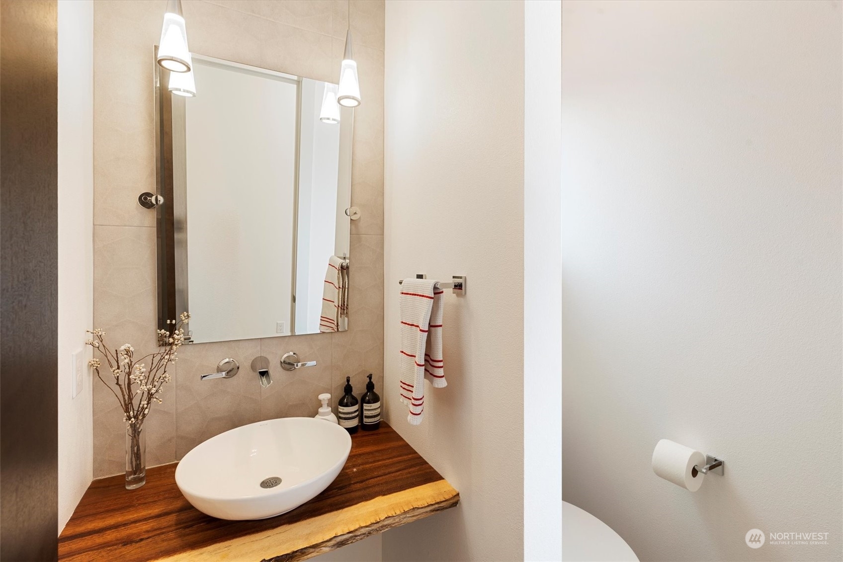 375 3rd Place Northwest Issaquah, WA 98027 - Photo 8 of 24 a bathroom with a sink and mirror