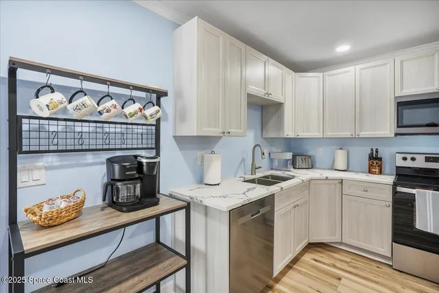 a kitchen with a oven and a refrigerator