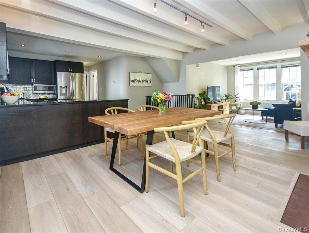 20 Oldwood Road South, Unit 1 Port Washington, NY 11050 - Photo 3 of 20 a view of a dining room with furniture and wooden floor