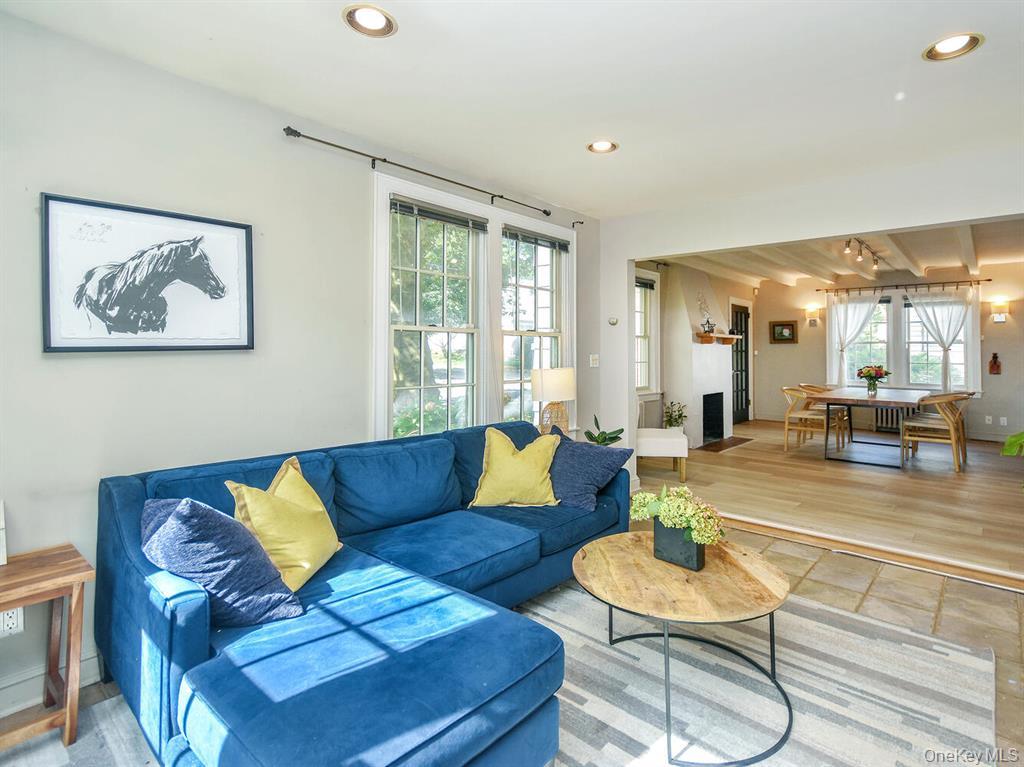 20 Oldwood Road South, Unit 1 Port Washington, NY 11050 - Photo 9 of 20 a living room with furniture and a large window