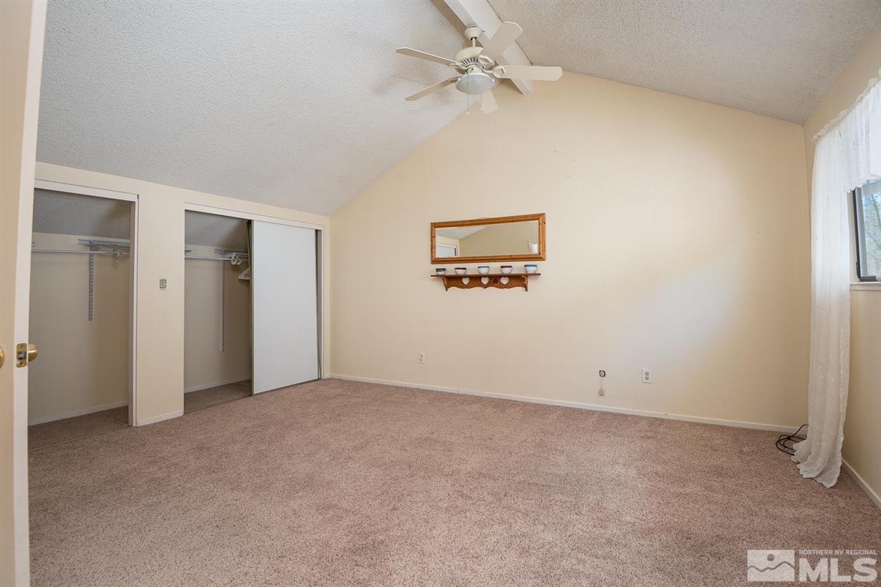 1235 Conway Lane Reno, NV 89503 - Photo 18 of 37 an empty room with windows and ceiling fan