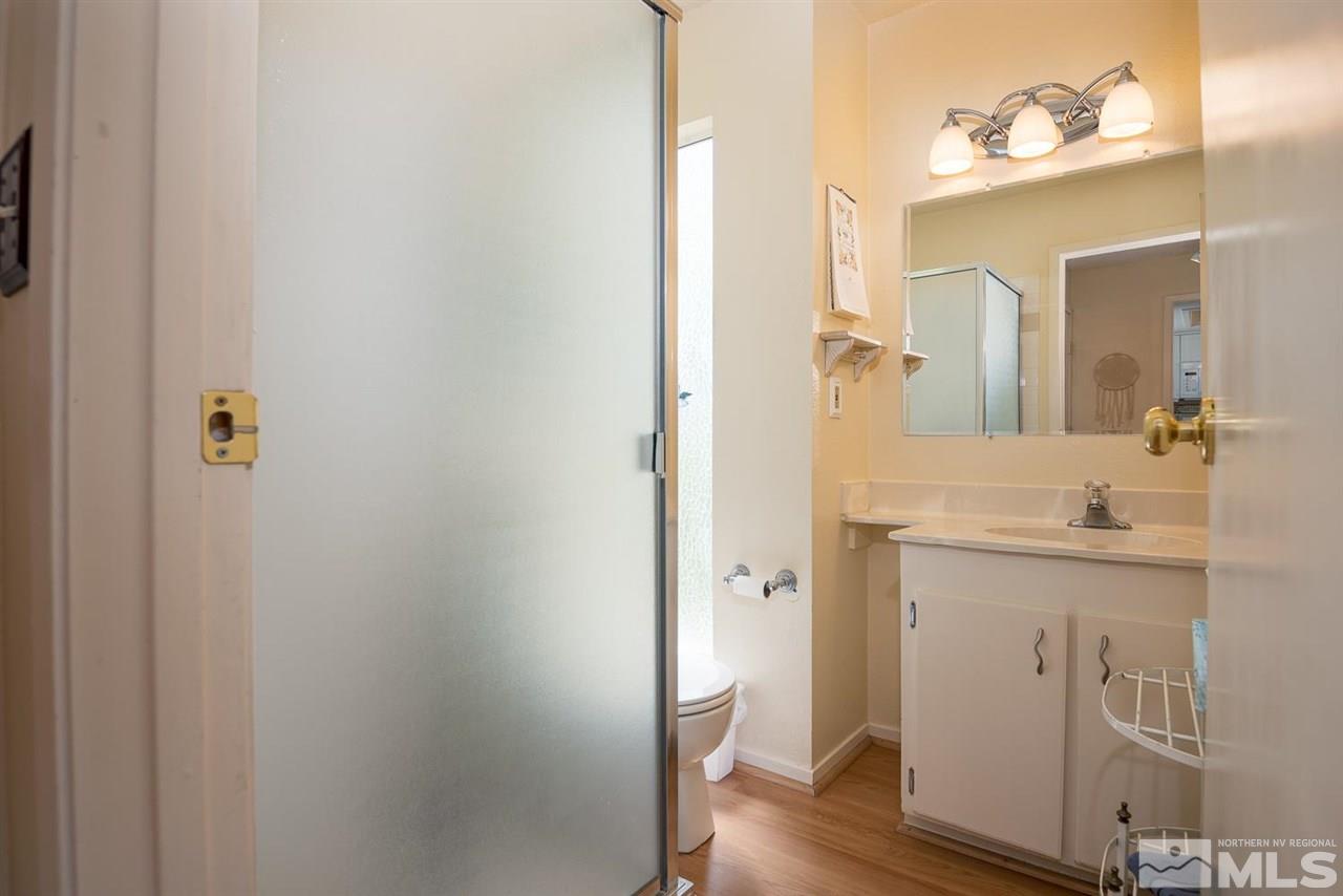 1235 Conway Lane Reno, NV 89503 - Photo 19 of 37 a en suite bathroom with a sink and mirror