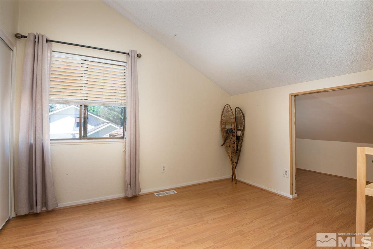 1235 Conway Lane Reno, NV 89503 - Photo 25 of 37 a view of a livingroom with a window and a ceiling fan