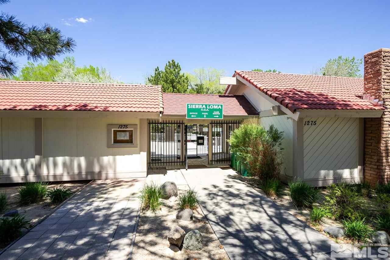 1235 Conway Lane Reno, NV 89503 - Photo 30 of 37 a front view of a house with a yard and potted plants