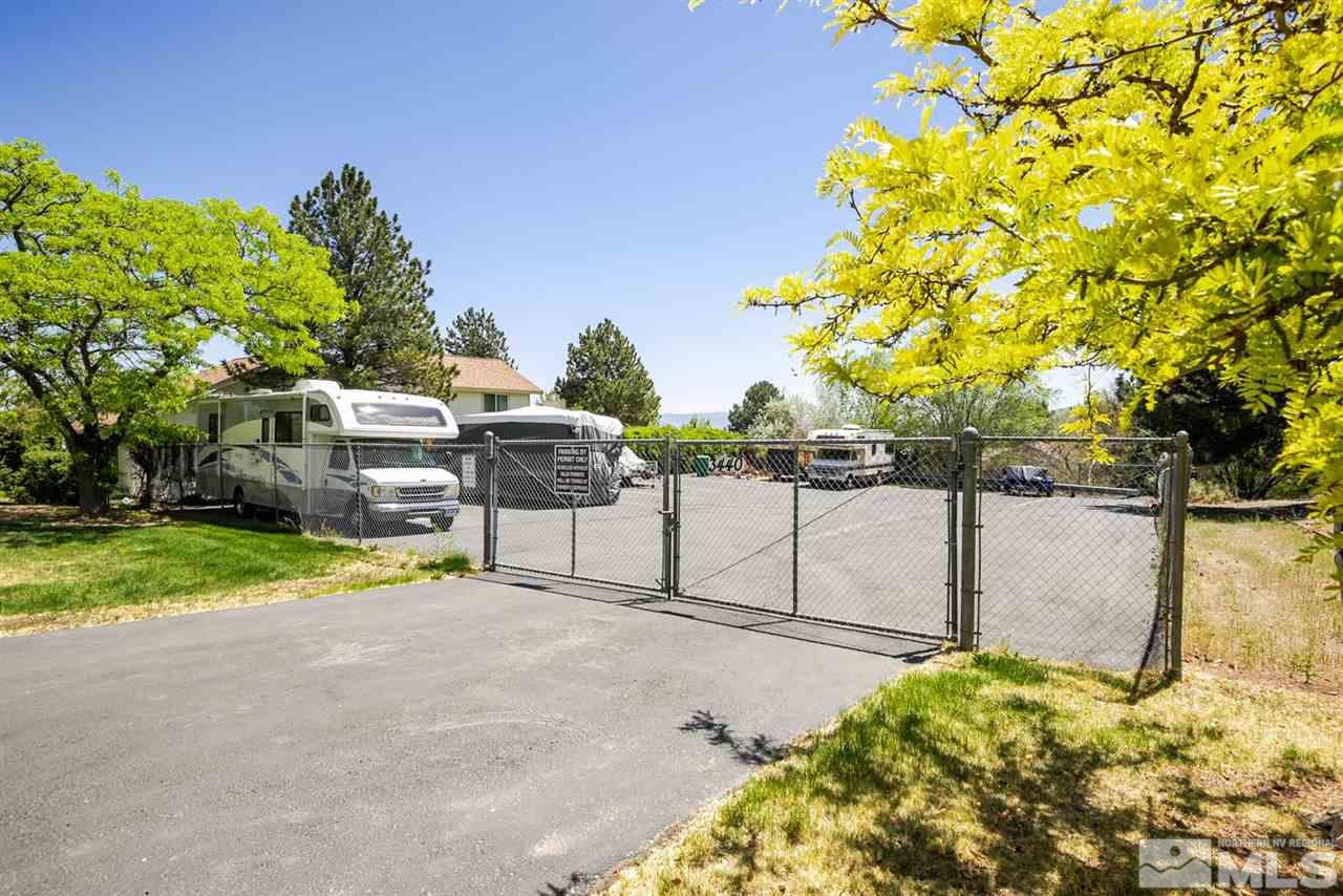 1235 Conway Lane Reno, NV 89503 - Photo 34 of 37 a view of backyard with seating area and trees around