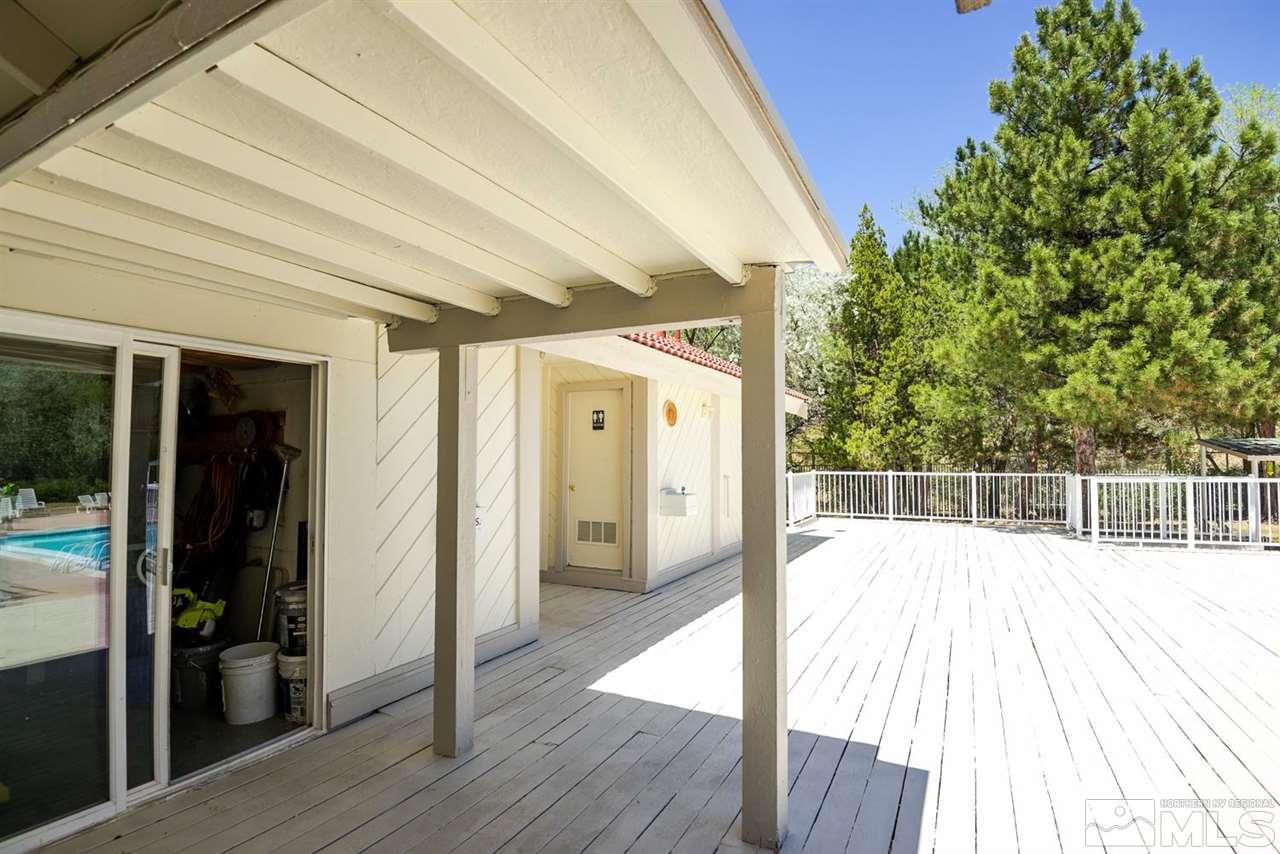 1235 Conway Lane Reno, NV 89503 - Photo 35 of 37 a hallway with wooden floor and glass door