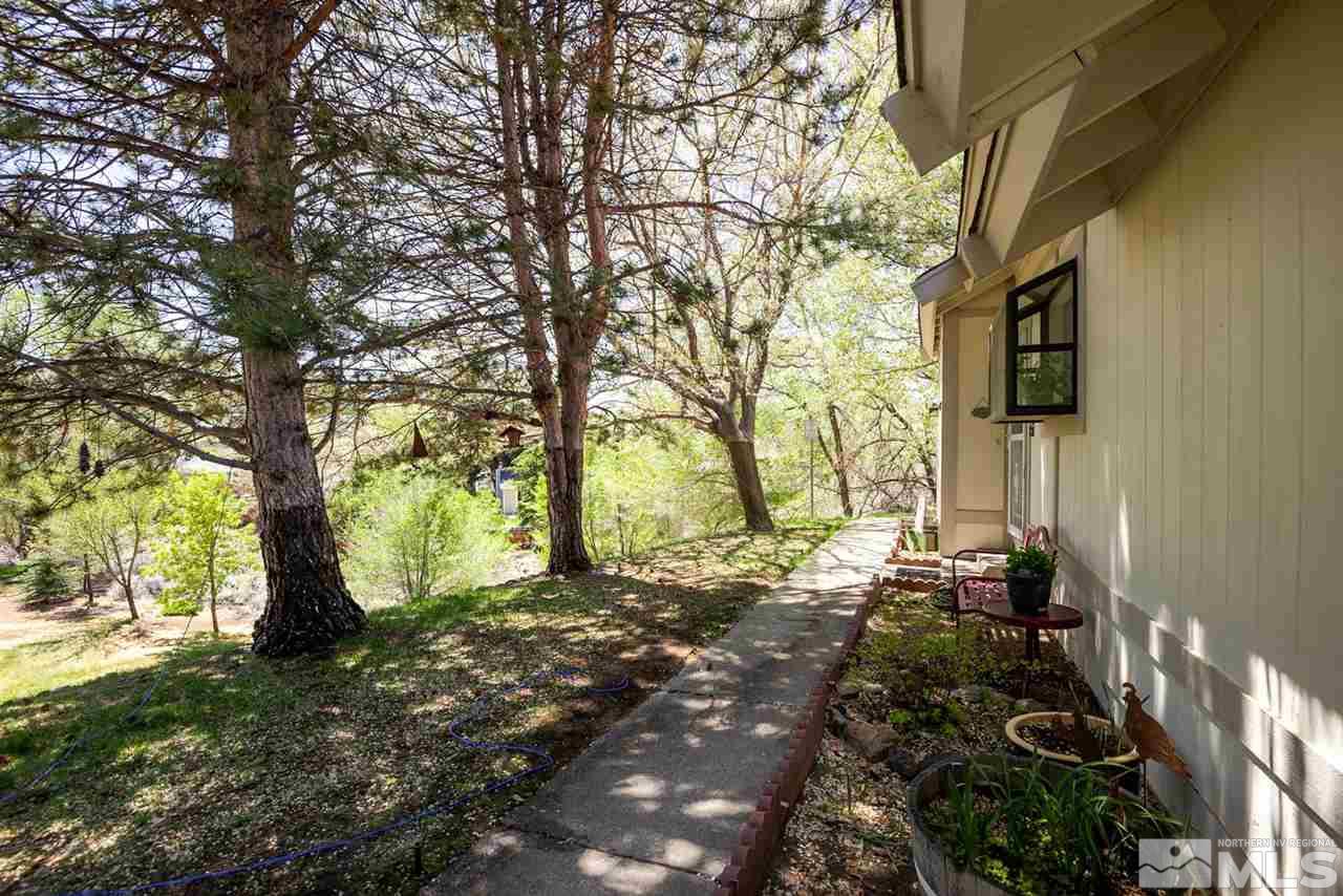 1235 Conway Lane Reno, NV 89503 - Photo 5 of 37 a backyard of a house with lots of green space