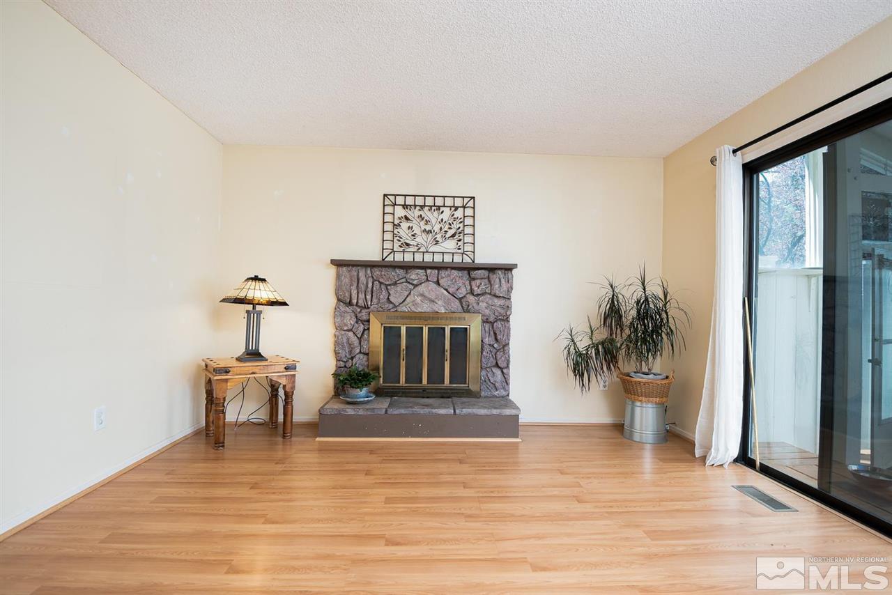 1235 Conway Lane Reno, NV 89503 - Photo 7 of 37 a living room with furniture and a fireplace