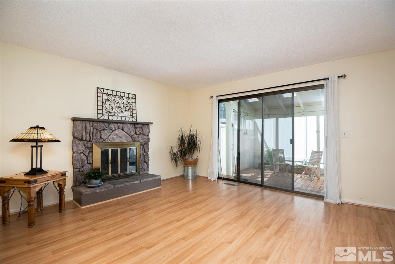 1235 Conway Lane Reno, NV 89503 - Photo 8 of 37 a living room with furniture and a fireplace