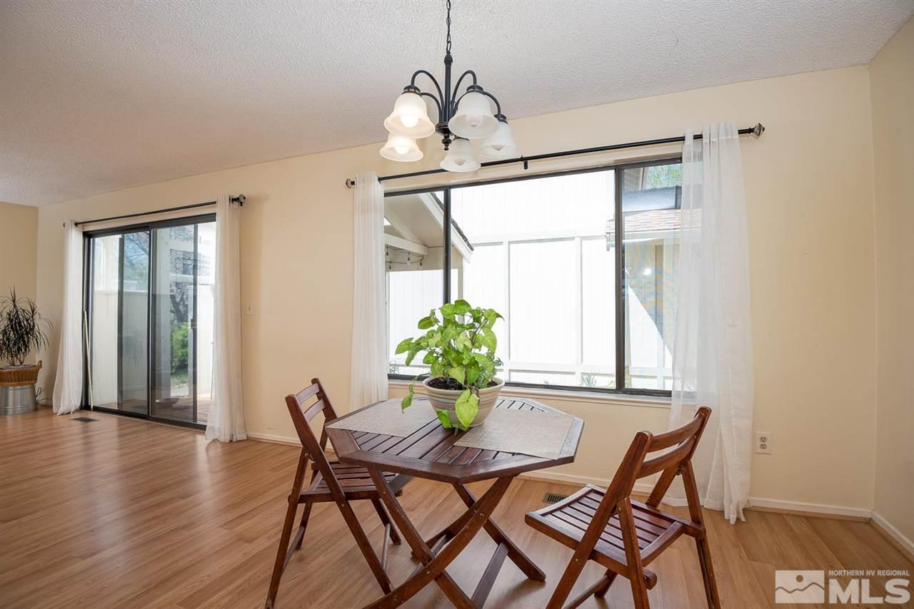 1235 Conway Lane Reno, NV 89503 - Photo 10 of 37 a dining room with furniture and wooden floor