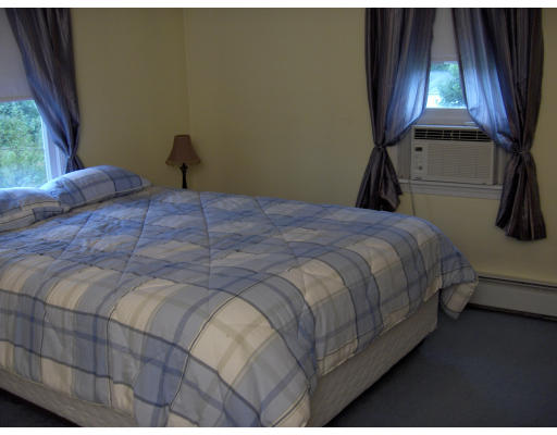 11 Rolling Ridge Road Rutland, MA 01543 - Photo 8 of 11 a bedroom with a bed and window