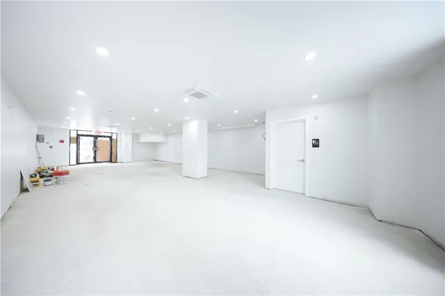 a view of a big room with windows