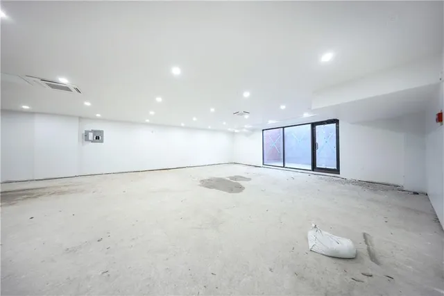 a view of a kitchen with a sink and cabinets