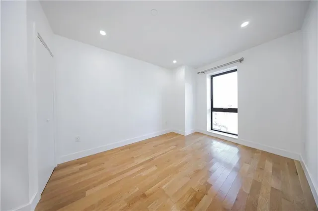 a view of a hallway with washer and dryer