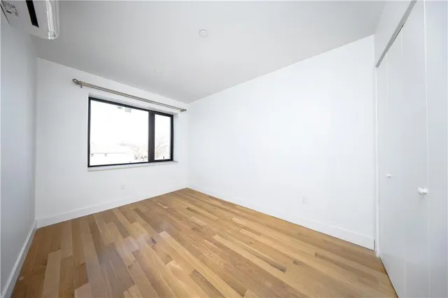 a view of a kitchen with a sink and a refrigerator