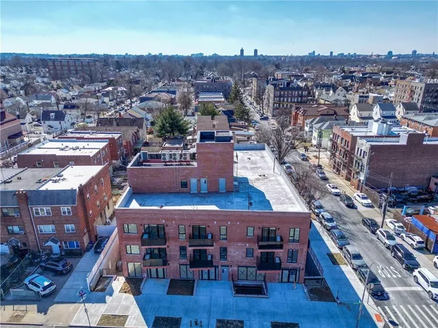 an aerial view of a kitchen with outdoor seating