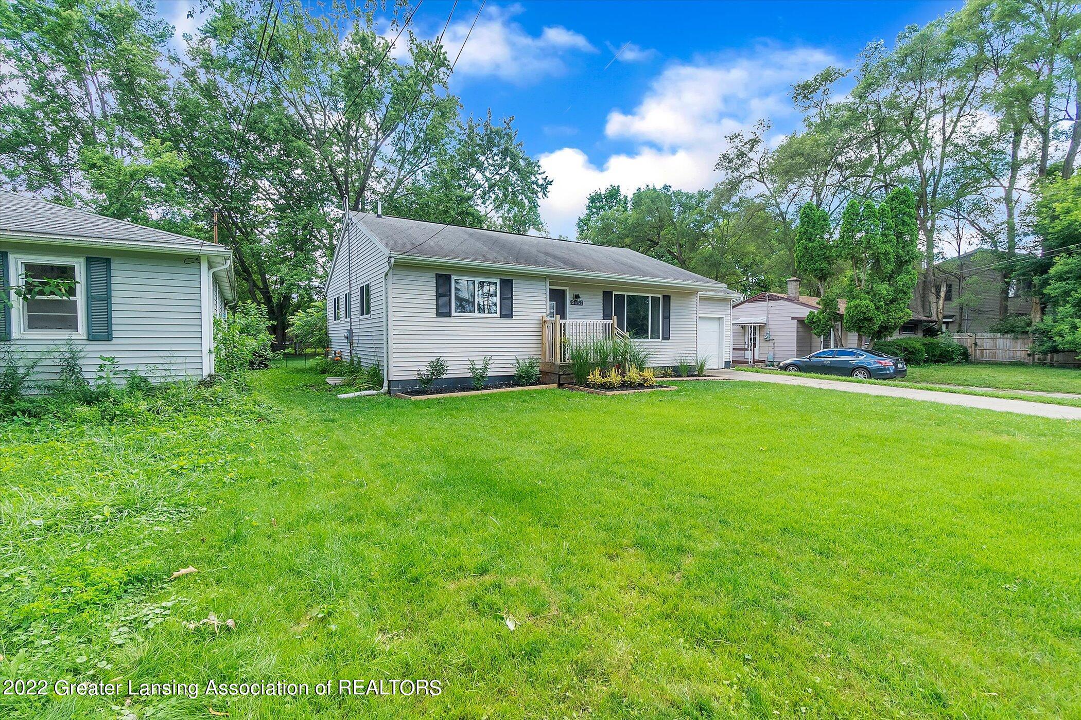 5802 Hughes Road Lansing, MI 48911 - Photo 3 of 37 02-5802-Hughes-Rd-WindowStill-Real-Estat