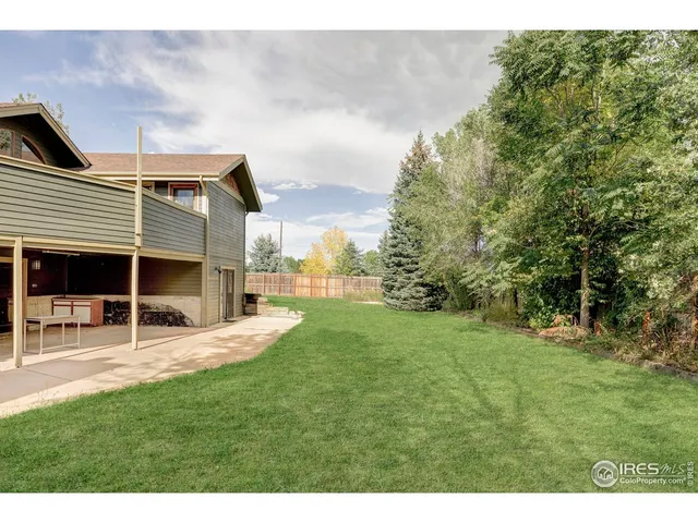 a view of a house with a yard porch and sitting area