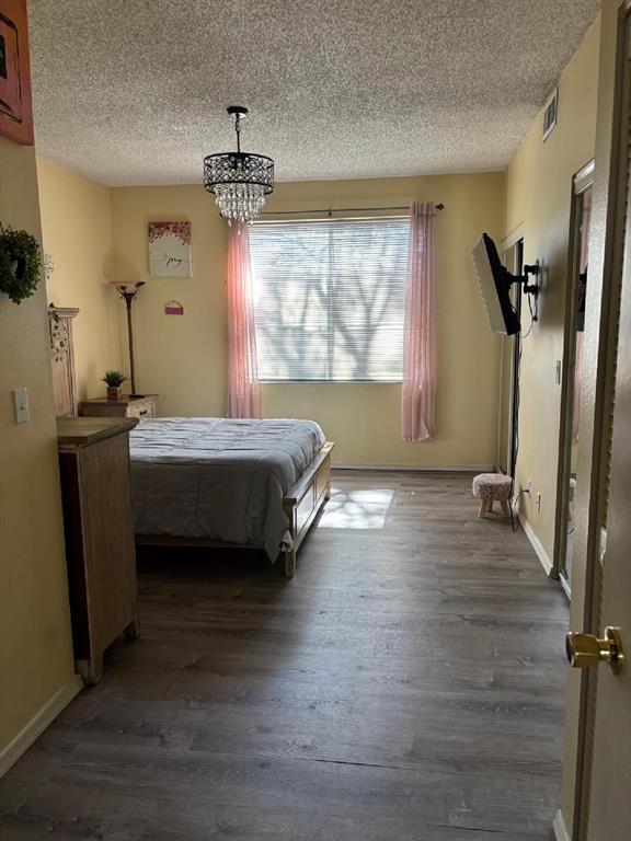 11050 Conch Court Tamarac, FL 33321 - Photo 13 of 17 a bedroom with a bed dresser and a window