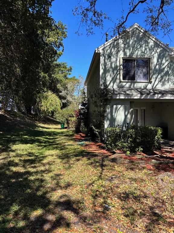 11050 Conch Court Tamarac, FL 33321 - Photo 3 of 17 a view of a house with a yard