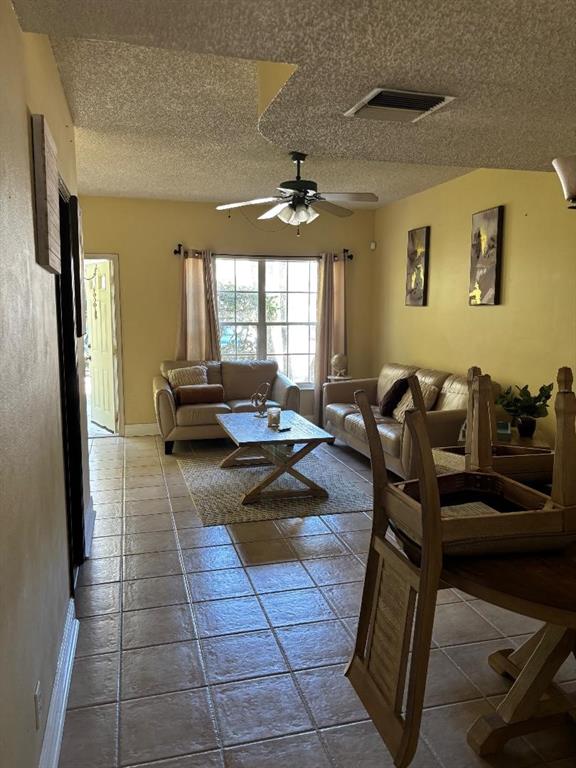 11050 Conch Court Tamarac, FL 33321 - Photo 9 of 17 a living room with furniture and a large window