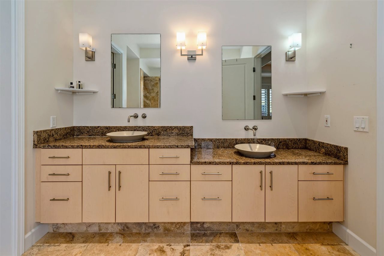 620 Mapuana Place Wailuku, HI 96793 - Photo 16 of 30 a bathroom with a granite countertop sink and a mirror
