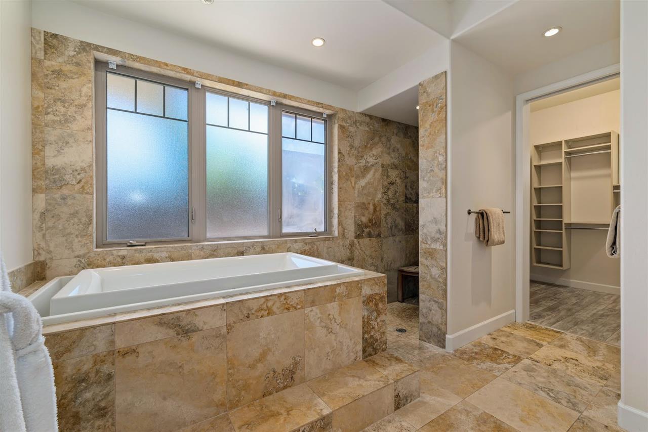 620 Mapuana Place Wailuku, HI 96793 - Photo 17 of 30 a spacious bathroom with a bathtub and a shower