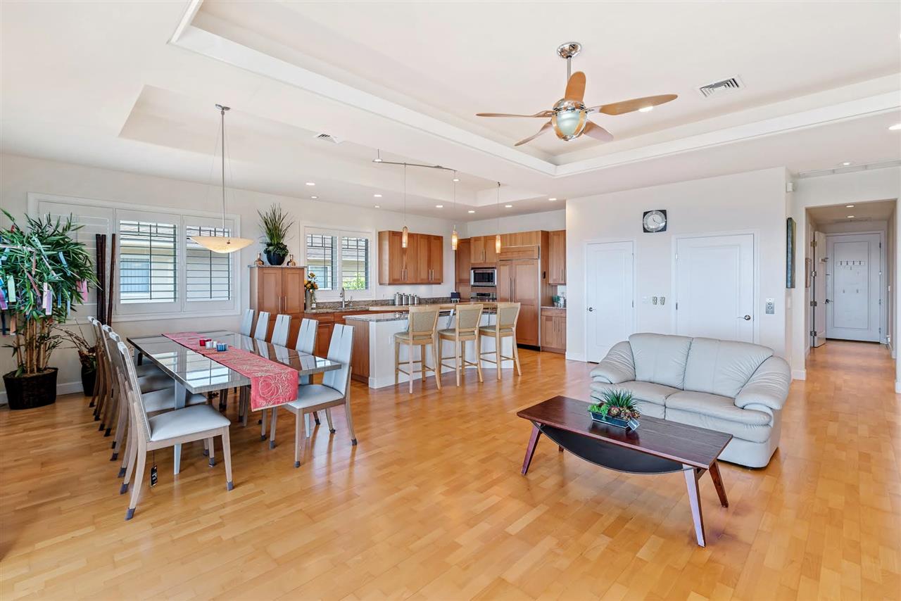 620 Mapuana Place Wailuku, HI 96793 - Photo 3 of 30 a living room with furniture kitchen view and a chandelier