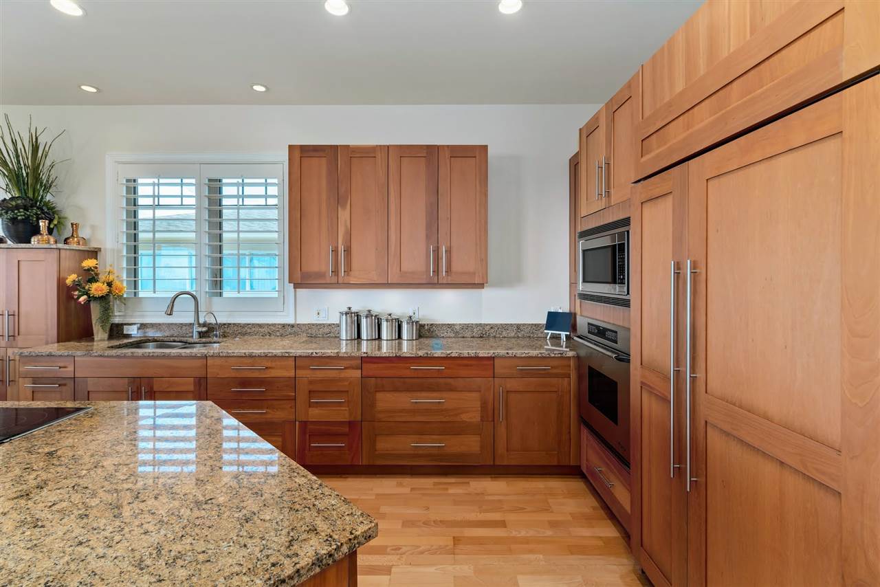 620 Mapuana Place Wailuku, HI 96793 - Photo 5 of 30 a kitchen with stainless steel appliances granite countertop a refrigerator and a sink