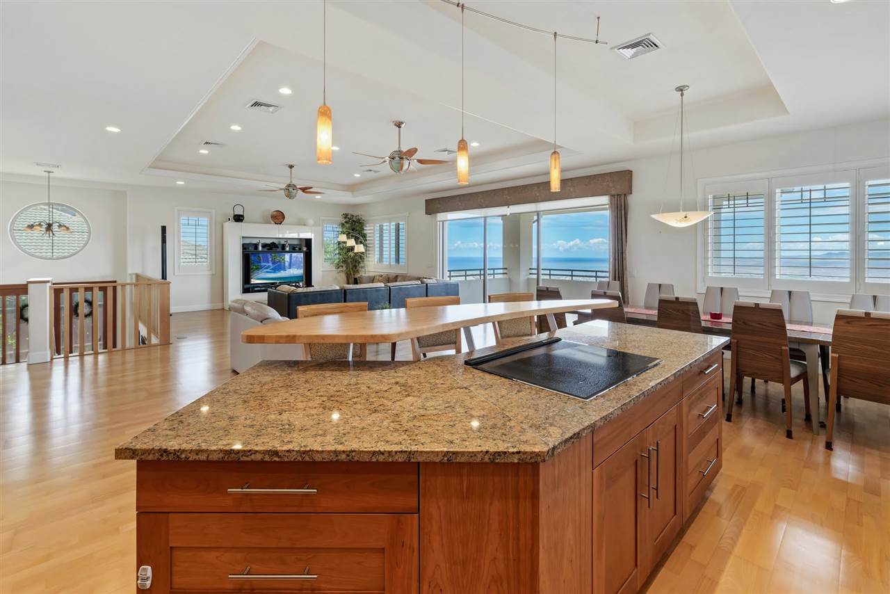 620 Mapuana Place Wailuku, HI 96793 - Photo 6 of 30 a kitchen with sink stove and cabinets