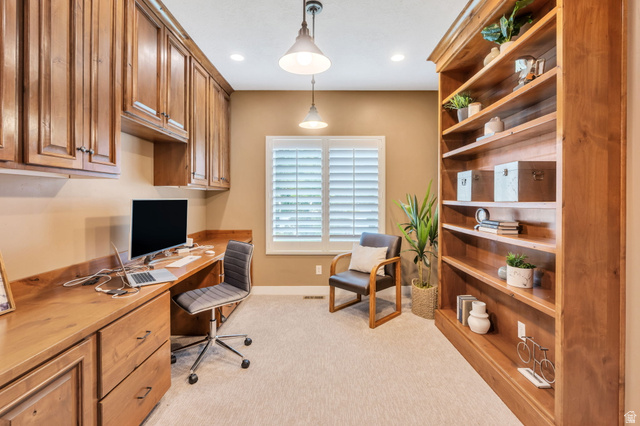 1355 West 1000 South Mapleton, UT 84664 - Photo 22 of 68 Dedicated workspace featuring extensive built-in cabinetry, a built-in desk with a wood-finish surface, and a full-height built-in bookcase